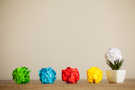 Creative idea concept.Inspiration, New idea and Innovation concept with Crumpled Paper on wood backgroundの写真素材