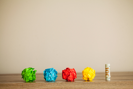 Creative idea concept.Inspiration, New idea and Innovation concept with Crumpled Paper on wood backgroundの写真素材