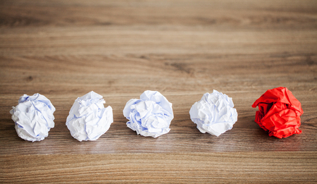 Creative idea concept. Crumpled paper balls on wood backgroundの写真素材