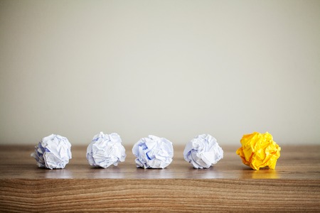 Creative idea concept.Inspiration, New idea and Innovation concept with Crumpled Paper on wood backgroundの写真素材