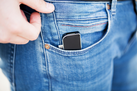 Man holding mini adapter for laptops and flash memoryの写真素材