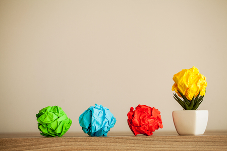 Creative idea concept.Inspiration, New idea and Innovation concept with Crumpled Paper on wood backgroundの写真素材