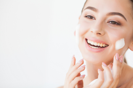 Beauty Face Care. Woman With Cream On Facial Skinの写真素材