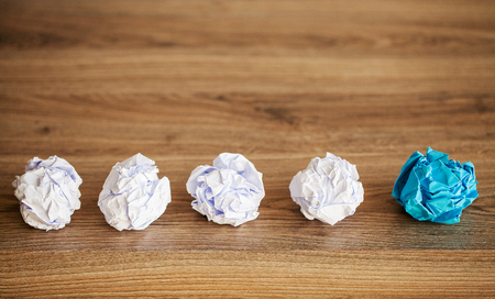 Creative idea concept. Crumpled paper balls on wood backgroundの写真素材