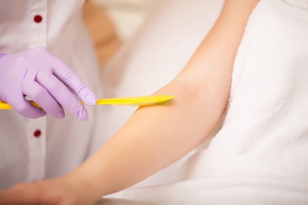 Body Care. Laser Hair Removal. Beautician Removing Hair Of Young Womans Armpit. Laser Epilation Treatment In Cosmetic Beauty Clinic. Hairless Smooth And Soft Skin. Health And Beauty Conceptの写真素材