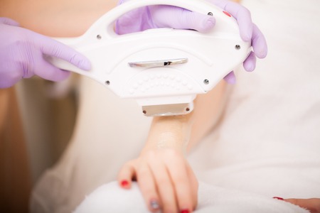 Body Care. Laser Hair Removal. Beautician Removing Hair Of Young Woman's Armpit. Laser Epilation Treatment In Cosmetic Beauty Clinic. Hairless Smooth And Soft Skin. Health And Beauty Concept.の写真素材