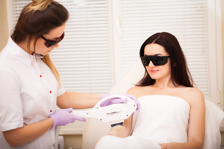 Skin care. Adult woman having laser hair removal in professional beauty salonの写真素材