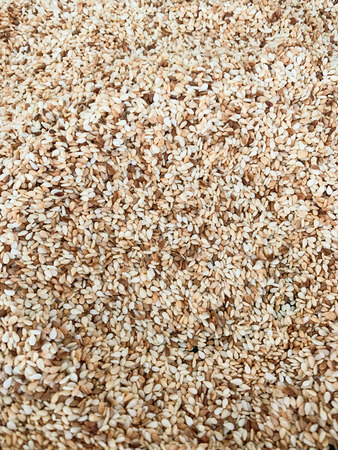 Toasted white sesame seeds full frame backgroundの写真素材