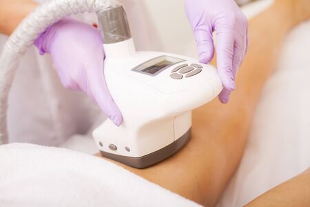 Body Care. Woman is in the process at the clinic lipomassage