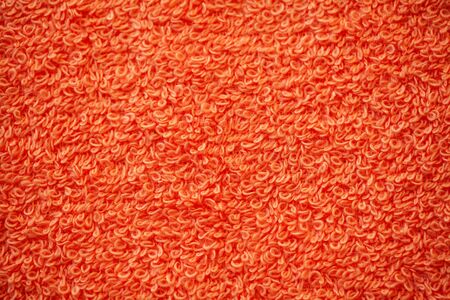 Red terry natural cotton towel background textureの写真素材