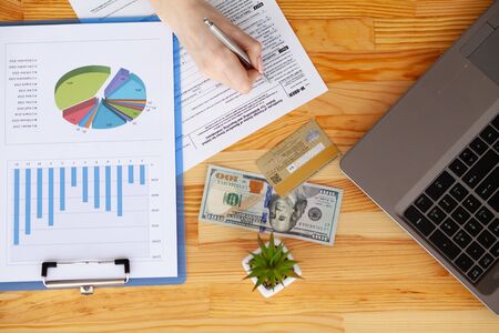 Financial Manager Sitting in Desk and Work With Financial Documents Companyの写真素材