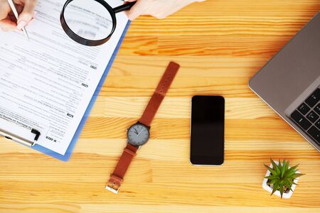 Financial Manager Sitting in Desk and Work With Financial Documents Companyの写真素材
