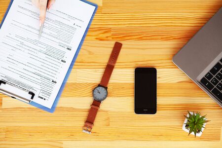 Financial Manager Sitting in Desk and Work With Financial Documents Companyの写真素材