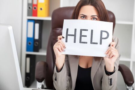 You need help ? The beautiful business woman at office asks of the helpの写真素材