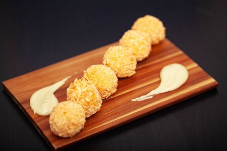 Tasty rice balls on a dark background