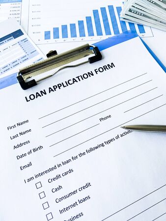 Loan application form document with graph on tableの写真素材
