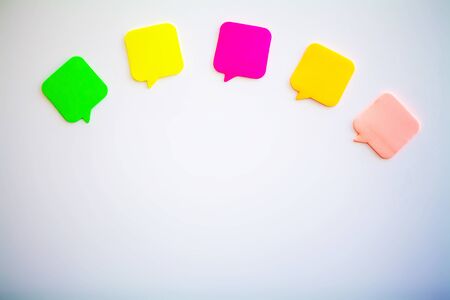 Colorful stickers on white wall. Empty Space for text