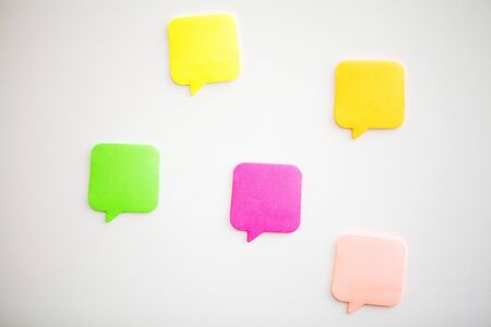 Colorful stickers on white wall. Empty Space for textの写真素材
