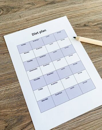 Health concept. Diet plan on wooden backgroundの写真素材
