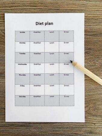 Health concept. Diet plan on wooden backgroundの写真素材