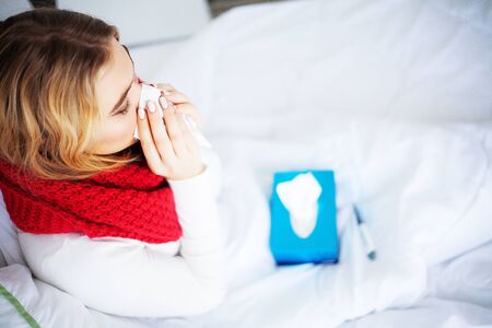 Flu and Sick Woman. Sick Woman Using Paper Tissue, Head Cold Problemの写真素材