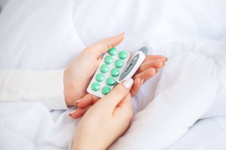 Medical pills. Woman extracting a pill from the blisterの写真素材
