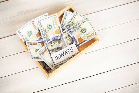 Donations and Charity. Donation Concept. Box of Donations and Heart on the White Background.の写真素材