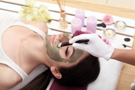 Young, beautiful and healthy woman in spa salon. Traditional oriental massage therapy and beauty treatments.の写真素材