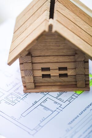 Building house on blueprints with plan - construction project