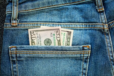 Denim blue jeans stack texture background closeup.