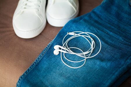 Jeans and sneakers on the store shelf.の写真素材