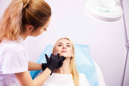 Lip Augmentation In Cosmetology Clinic. Beautiful Woman Getting Beauty Injection For Lips.の写真素材