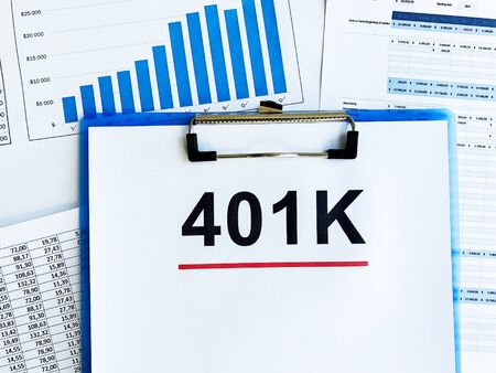 Paper with 401k plan on wood tableの写真素材