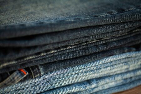 Denim blue jeans stack texture background closeupの写真素材