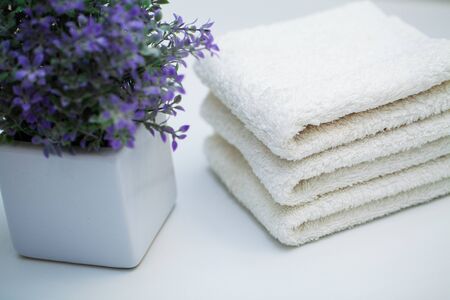 White towels on white table in bath room background.の写真素材