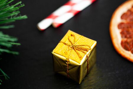New year gift with christmas decorations on dark backgroundの写真素材
