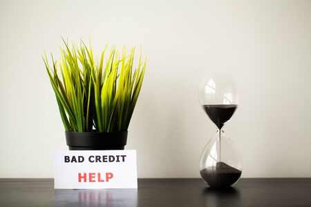 Bad credit, written on a white sheet of paperの写真素材
