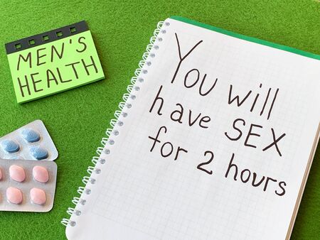 Pills for mens sexual health and notepad with textの写真素材