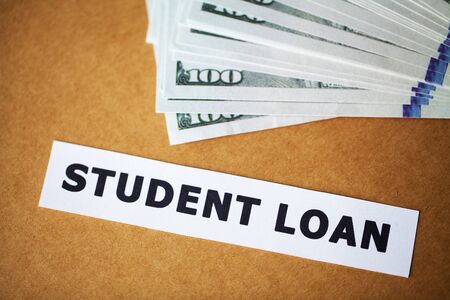 Credit concept. Student loan written on white cardの写真素材