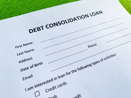 Debt consolidation loan document with graph on table.の写真素材