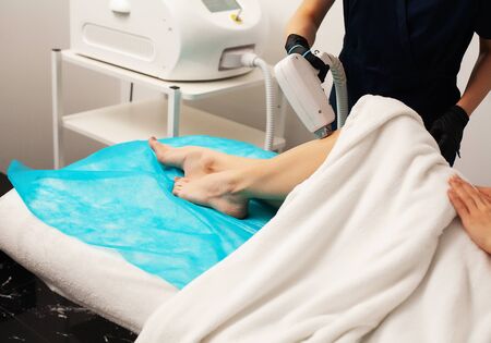 Young Woman Receiving Laser Epilation On Beauty Center.の写真素材