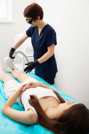 Woman getting laser treatment in a beauty salonの写真素材