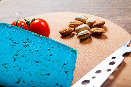 Chunk of blue cheese on wooden background.の写真素材