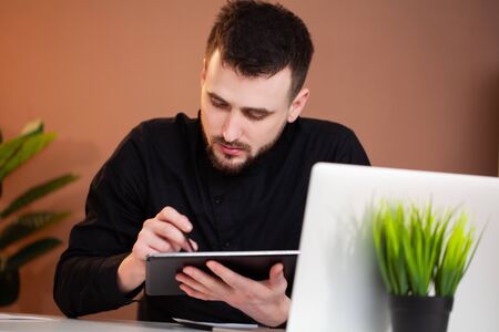Employee working on a tablet in the office