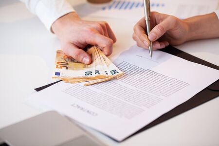 Employee is given a bribe for a favorable signing of the contract.