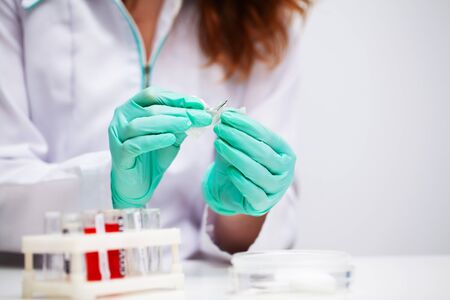 Woman at the hospital submits a blood test for a coronavirus.
