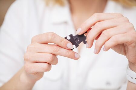 Business concept, womans hands make up a puzzle symbolizing the success of the company