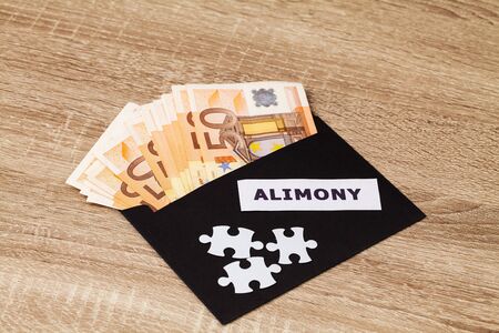 The concept of paying alimony, money in a paper envelope.の写真素材