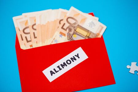 The concept of paying alimony, money in a paper envelope.の写真素材