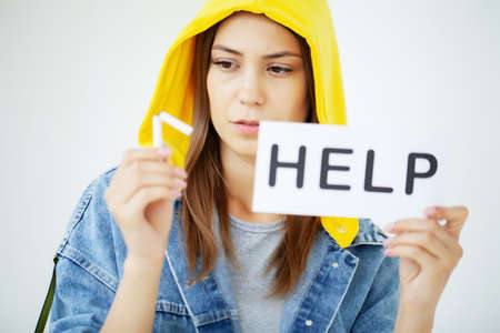 Stop smoking, a young woman communicates her position about the harmfulness of cigarettesの写真素材